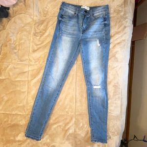 blue distressed ripped jeans